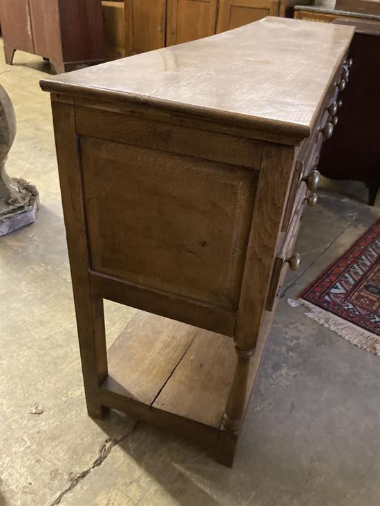 A George III style oak low dresser, width 182cm, depth 43cm, height 89cm